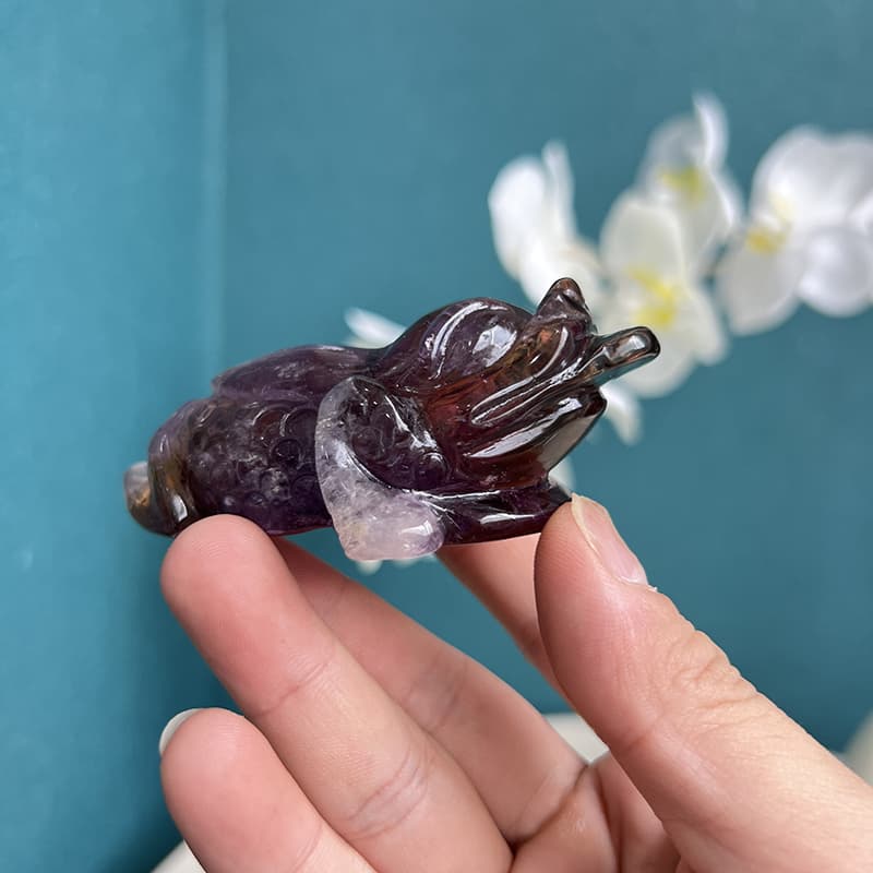 Close-Up of Golden Toad Crystal Carving in Ametrine