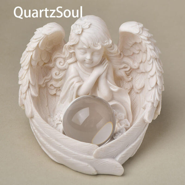 Angel wing crystal ball display with clear quartz sphere showcasing perfect fit and elegant design