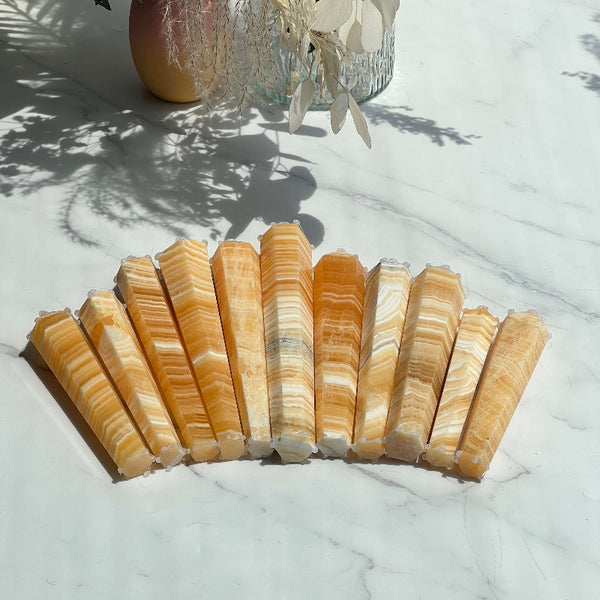 Side view of Banded Orange Calcite Tower showing natural orange striations