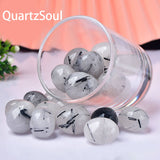 Premium Black Rutilated Quartz Tumbled Stones with Natural Black Rutile Inclusions in Glass Display