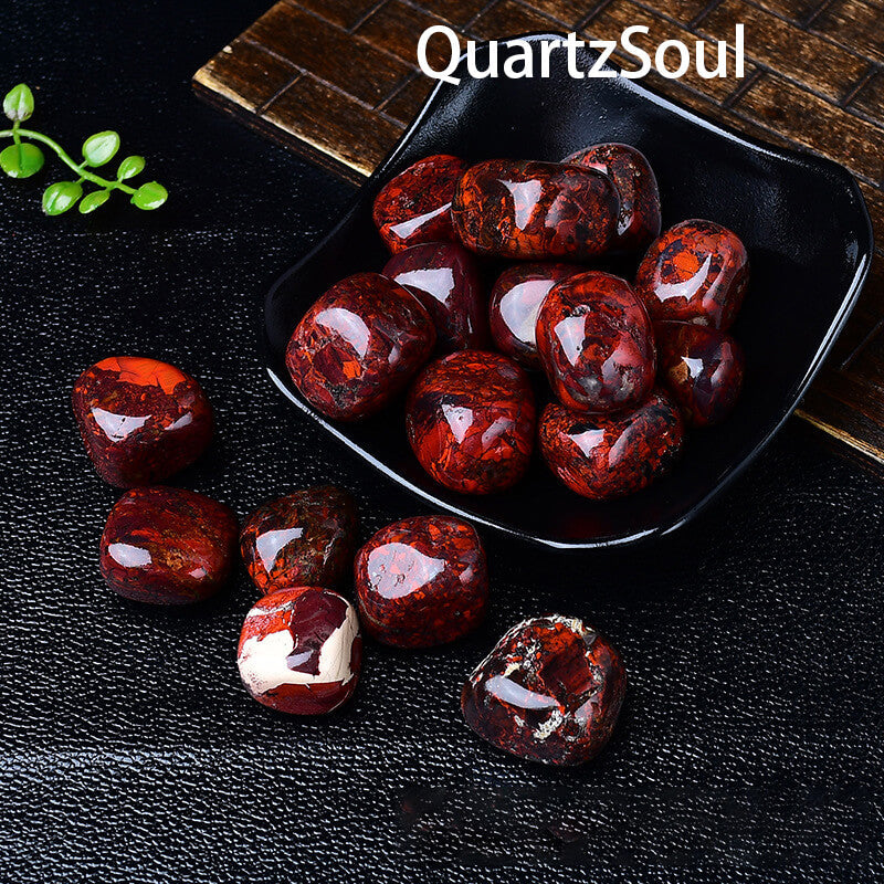 Premium quality bloodstone tumbled crystals displayed in black bowl showcasing vibrant colors