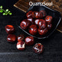 Premium quality bloodstone tumbled crystals displayed in black bowl showcasing vibrant colors