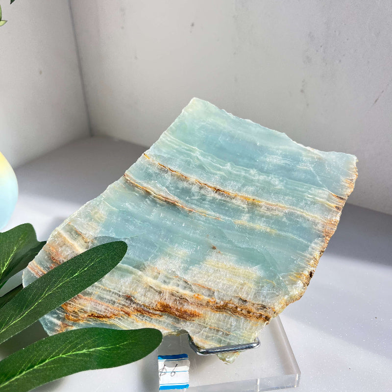 Blue onyx slab being used for energy healing work