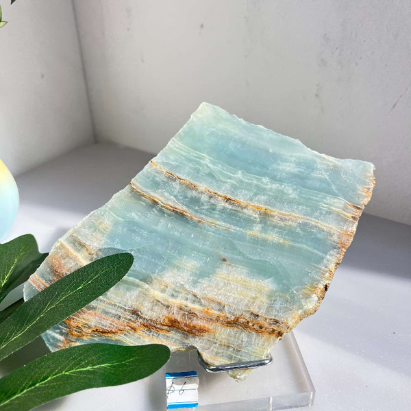 Blue onyx slab being used for energy healing work