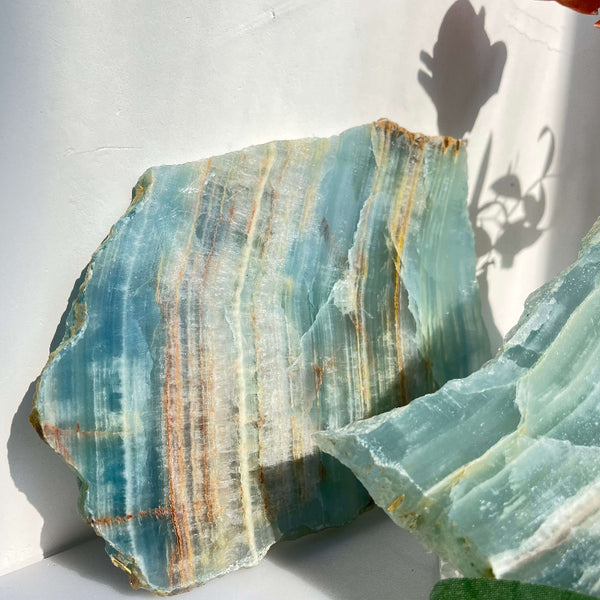 Blue onyx slab displayed in metaphysical shop setting