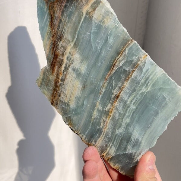 Blue onyx slabs in retail display arrangement