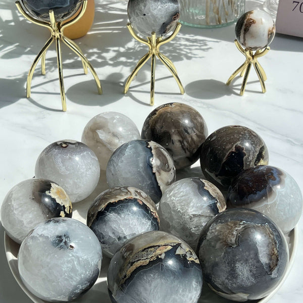 Blue Volcanic Agate Crystal Sphere on Display Stand