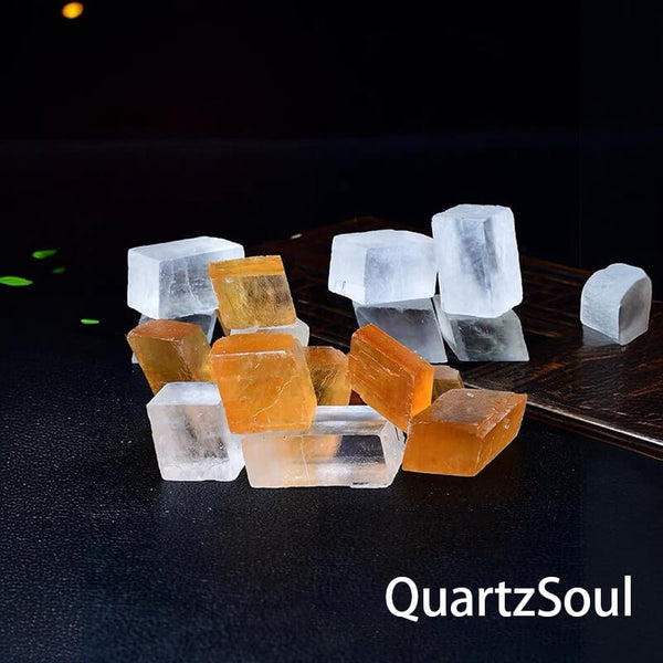 Raw calcite healing stones arranged on wooden display surface