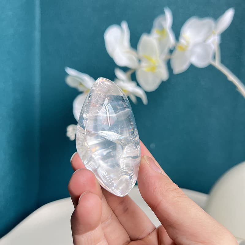 Side view of clear quartz free form revealing natural crystalline structure