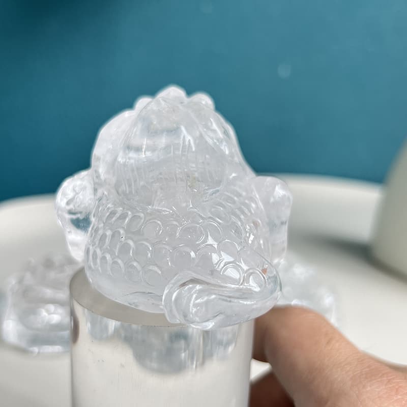 Gift presentation of clear quartz golden toad crystal carving