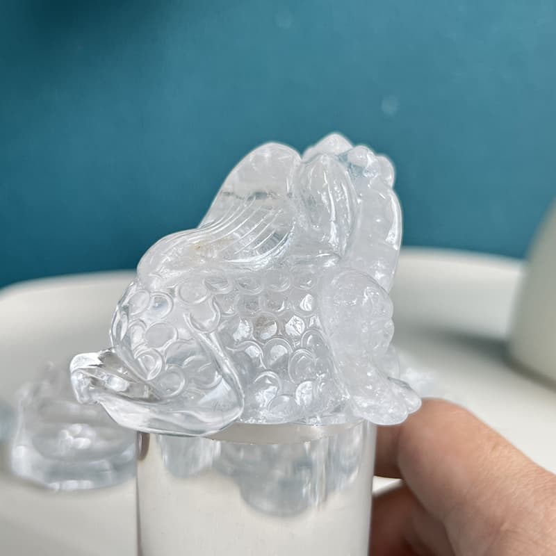 Clear quartz golden toad crystal carving on meditation altar setting