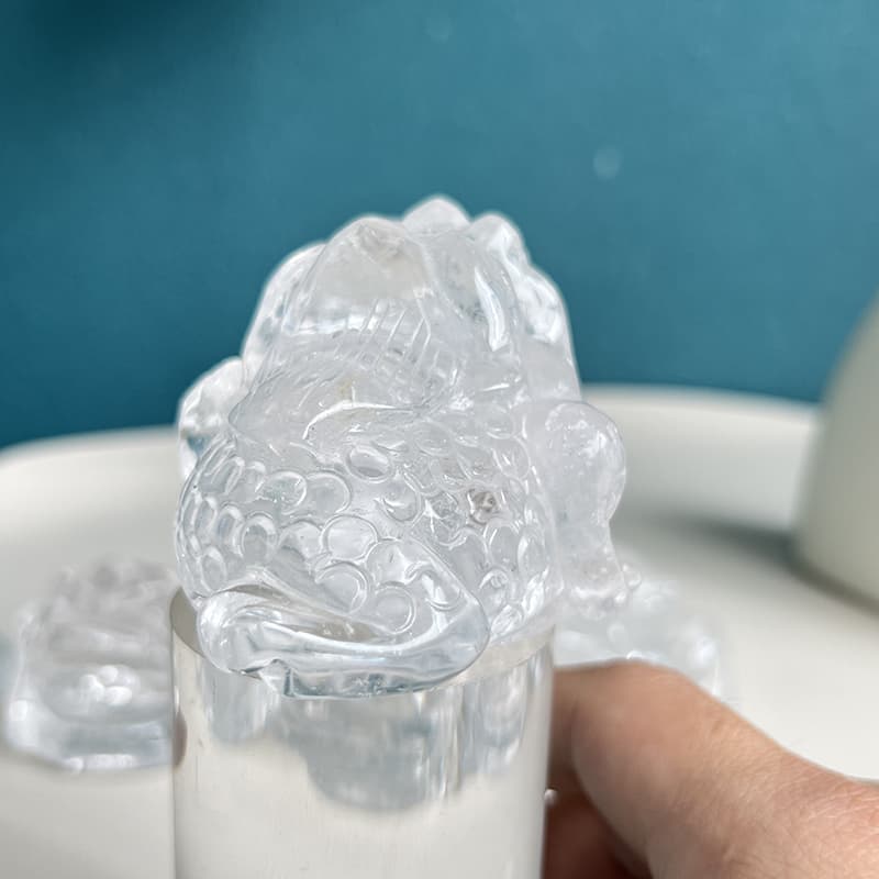 Rainbow inclusions in clear quartz golden toad crystal carving