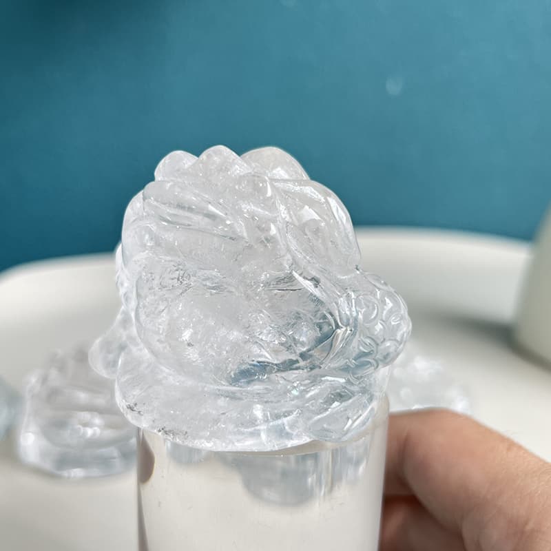 Spiritual practice with clear quartz golden toad crystal carving