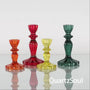 Elegant crystal candle holders in red, green, yellow and orange for taper candles and crystal display