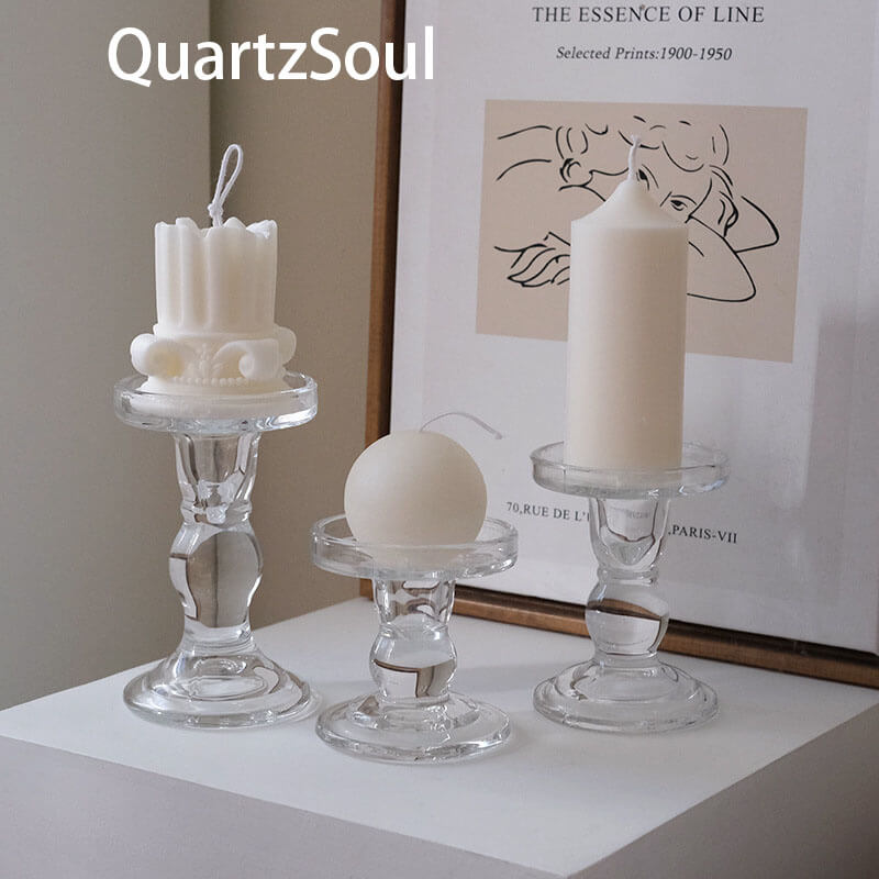 Set of three crystal glass candle holders displaying different types of candles elegant home decor