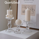 Set of three crystal glass candle holders displaying different types of candles elegant home decor