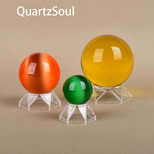 Crystal ball stands displaying various colored spheres in different sizes
