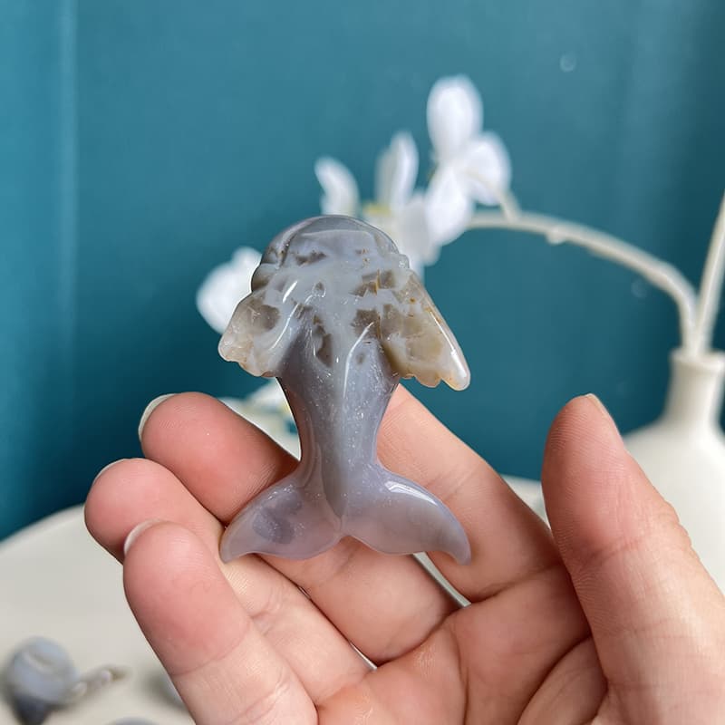 White agate crystal dolphin sculpture showing translucent properties