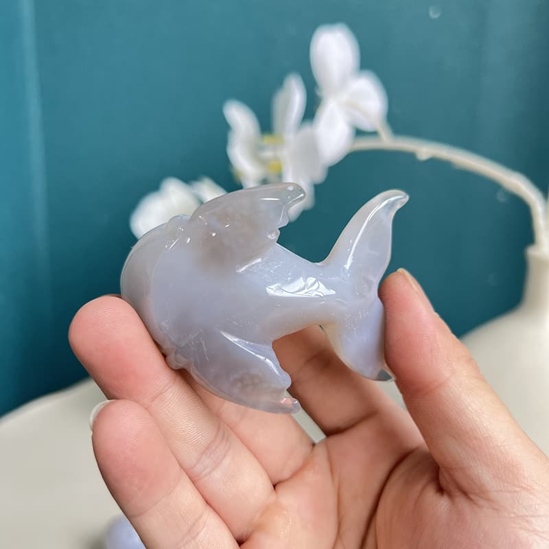 Close-up detail of agate crystal dolphin showing natural patterns