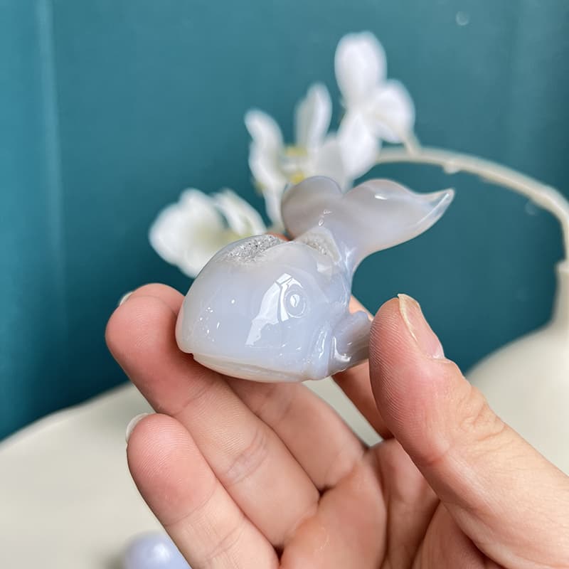 Multiple dolphin agate crystal carvings showing variation in patterns