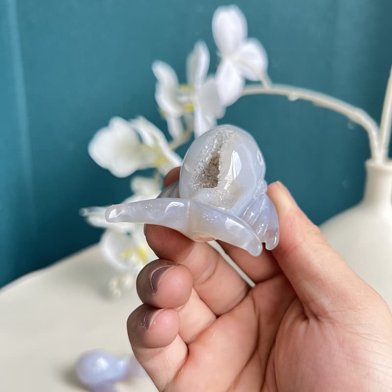 Profile view of dolphin agate crystal carving showing sleek design