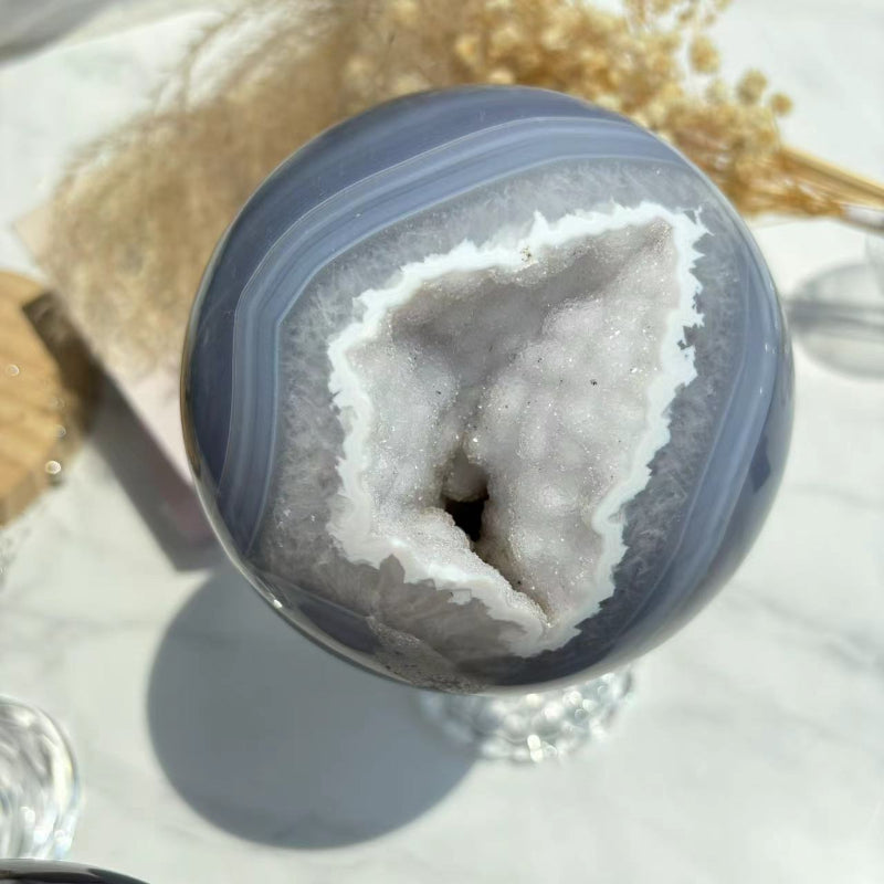 Druzy Agate Sphere Reflecting Light Through Crystal Formations