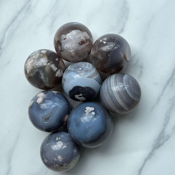 Flower Agate Sphere used in crystal healing practice