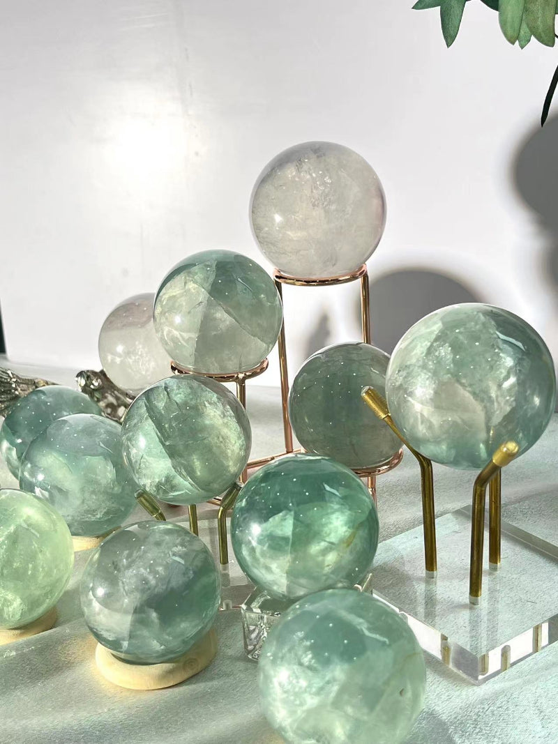 Light green fluorite sphere in meditation space arrangement