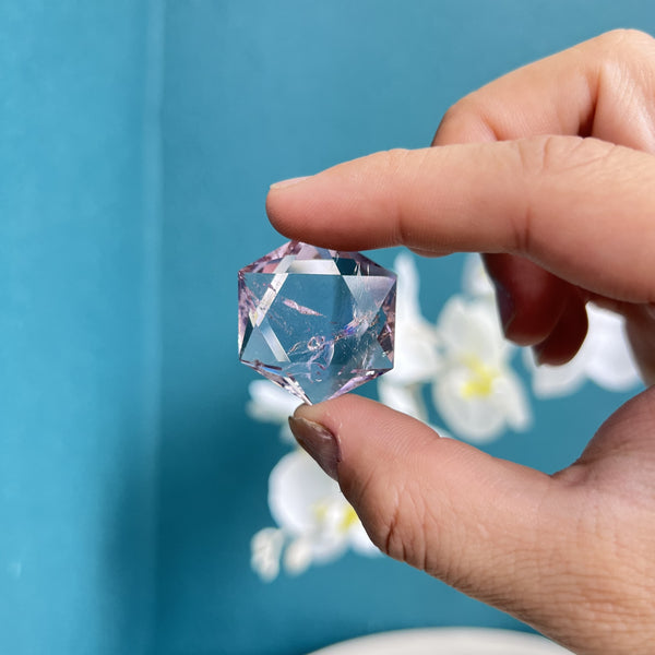 Detailed view of geometric angles on hexagram fluorite crystal carving