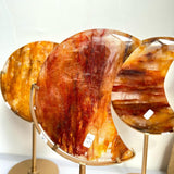 Collection of various sized Golden Healer Moon Crystals for wholesale buyers
