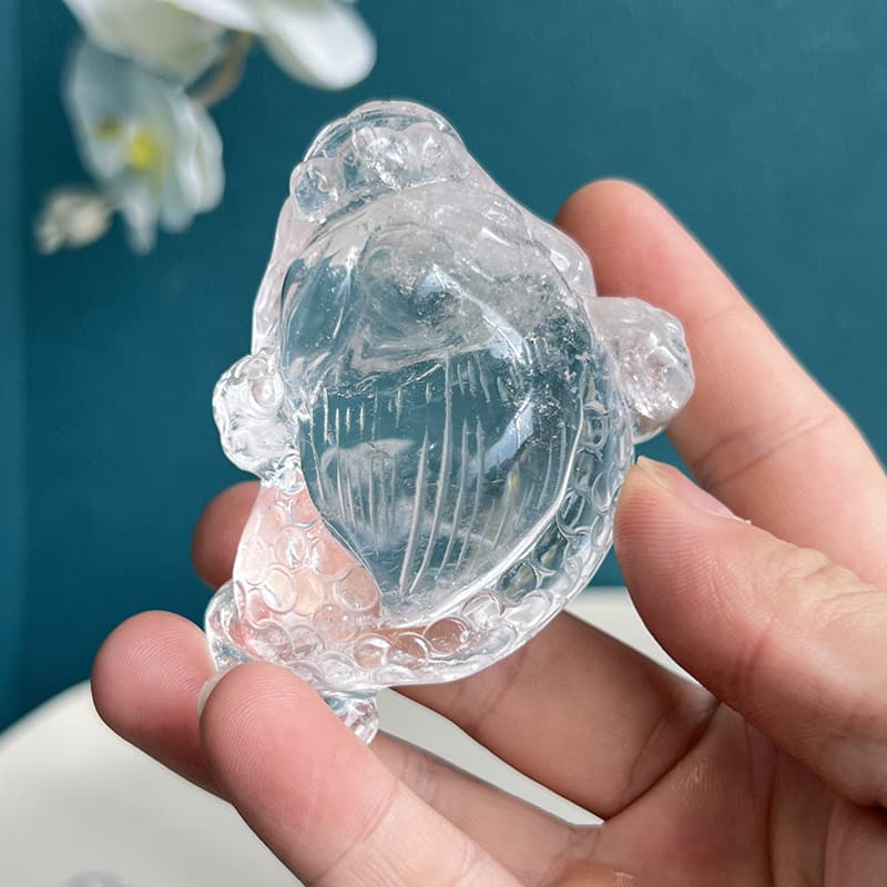 Texture details of handcrafted crystal toad carving in natural light
