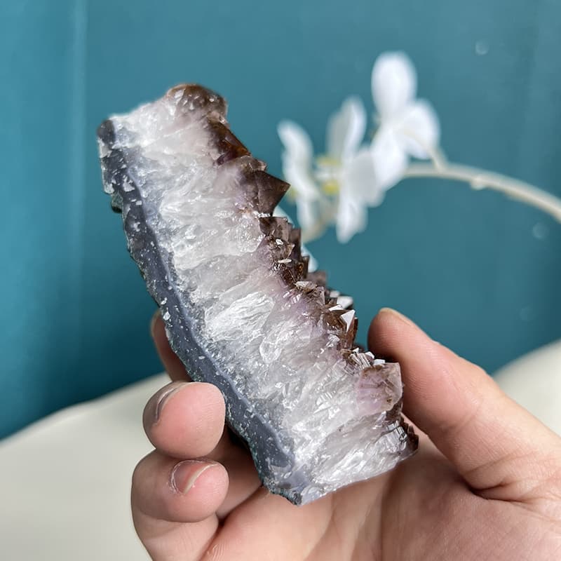 Large natural amethyst cluster with vibrant purple crystal points