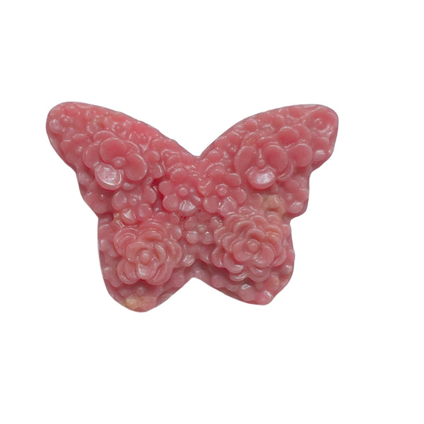 Rhodonite butterfly crystal carving displayed on wooden stand for home decor