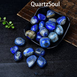 Lapis Lazuli tumbled stones displayed in black bowl showing deep blue color