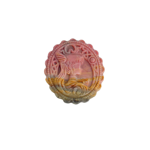 Pink Rhodonite crystal carving with magical girl pattern showing natural color gradient