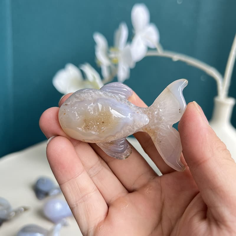 Close-up detail of natural agate patterns in dolphin carving
