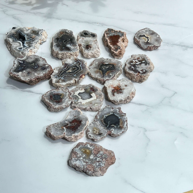 Natural agate slab with polished surface showing colorful mineral bands