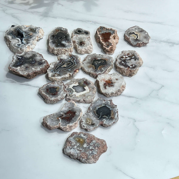 Natural agate slab with polished surface showing colorful mineral bands