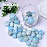 Natural Aquamarine tumbled stones bulk collection with various blue shades and patterns