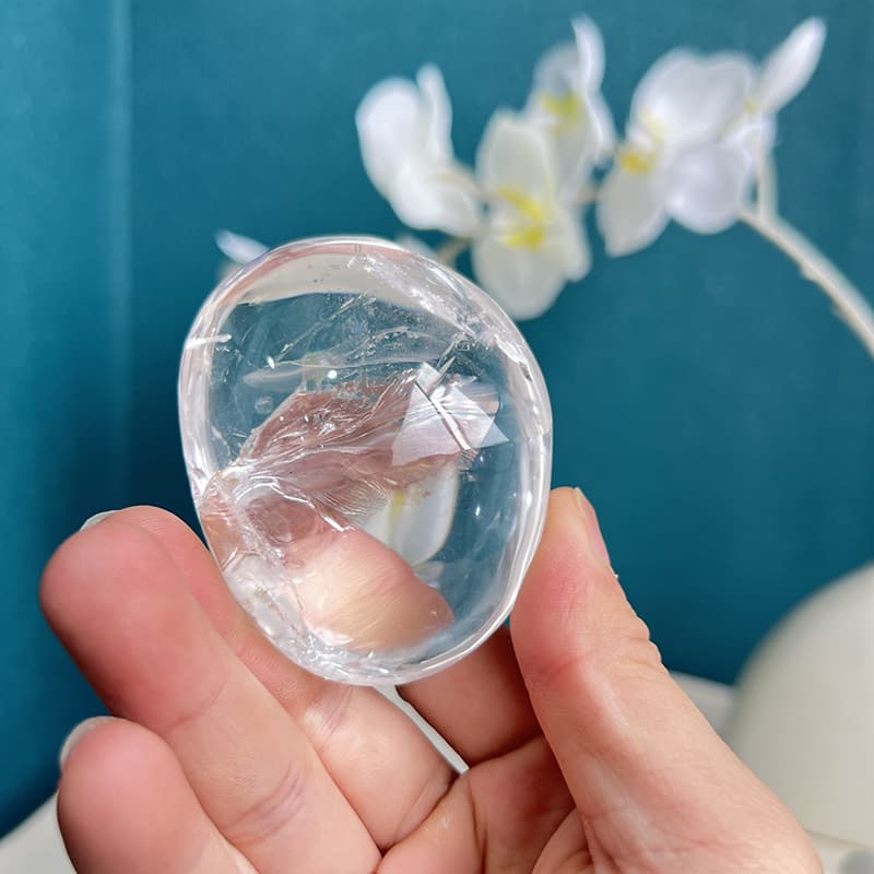 Clear quartz free form crystal displaying beautiful light reflection properties