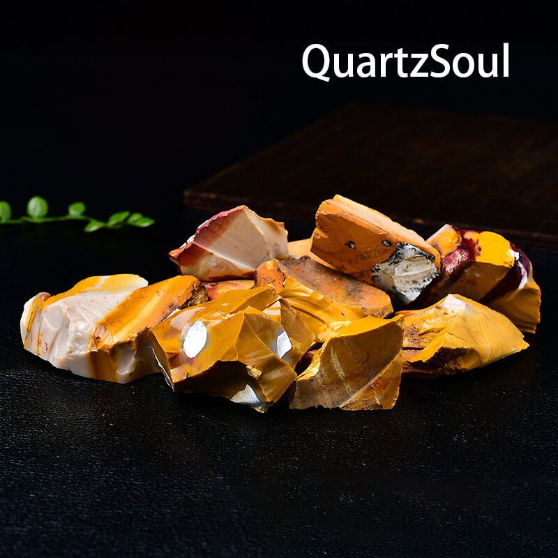 Natural raw Mookaite crystal stones with vibrant yellow and burgundy patterns
