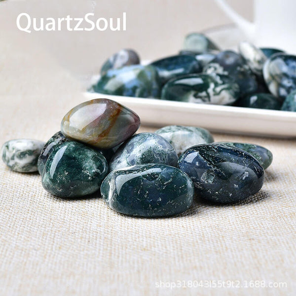 Natural polished Moss Agate tumbled stones featuring green forest-like inclusions