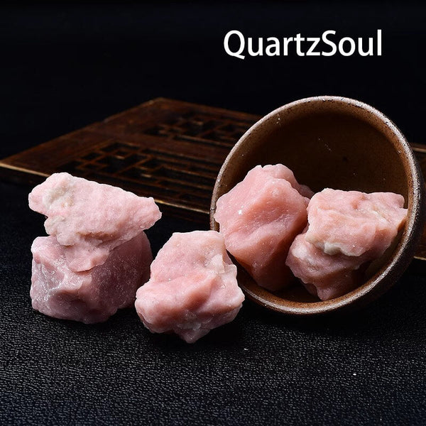 Natural raw pink opal crystal specimens in decorative bowl healing stones