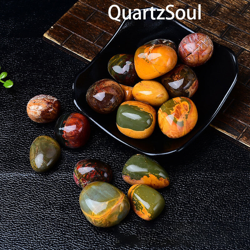 Collection of polished Ocean Jasper tumbled stones displayed in black bowl