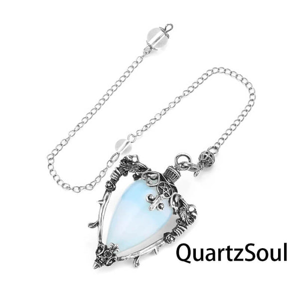 Opal teardrop crystal pendulum with ornate silver setting
