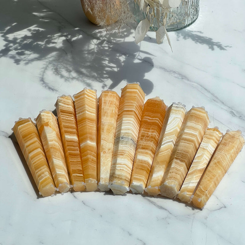 Banded Orange Calcite Tower in meditation space for crystal healing properties