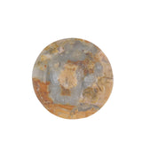 Close-up detail of pink and black patterns in natural rhodonite bear sculpture