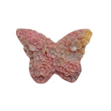 Pink rhodonite butterfly crystal with natural black veining for emotional balance