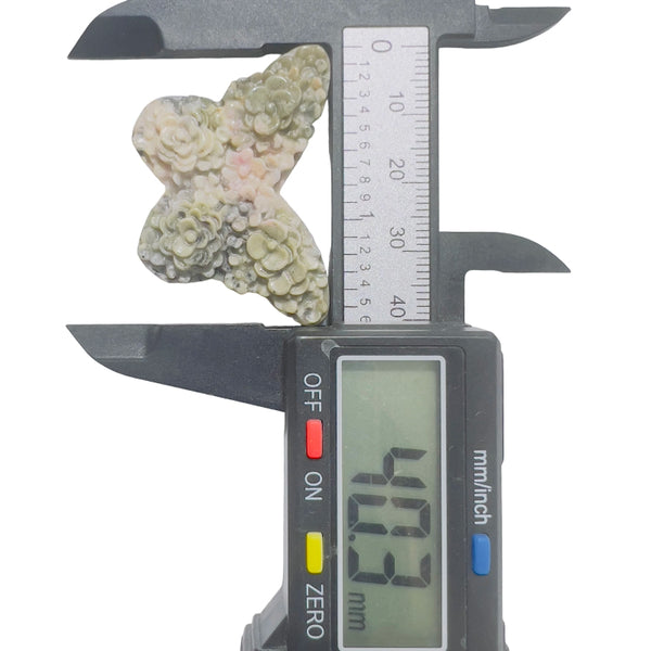 Pink rhodonite butterfly crystal with healing properties for emotional balance