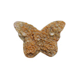 Close-up detail of pink rhodonite butterfly wings with natural stone variations